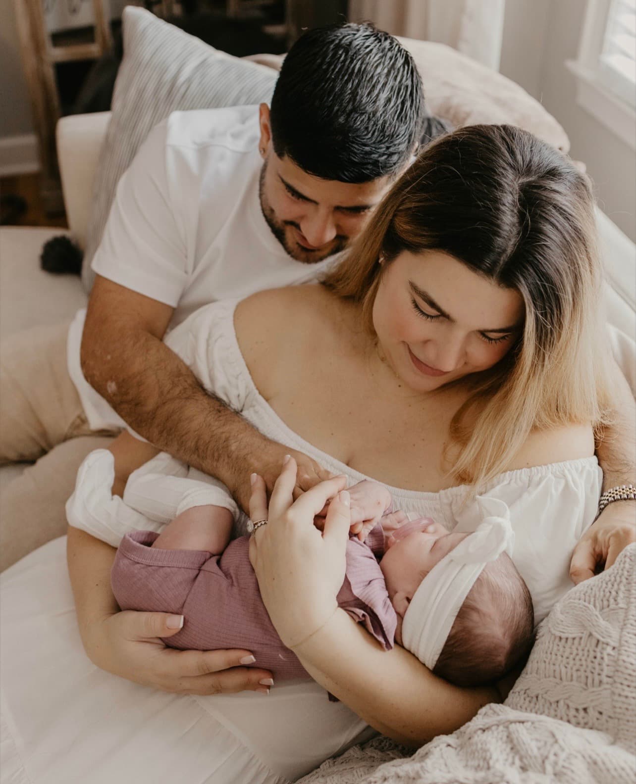 Steve and his wife with their newborn